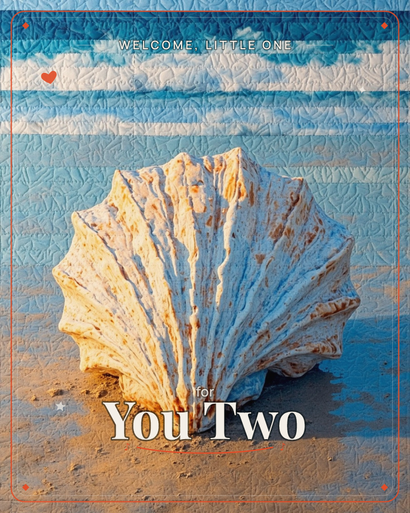 A large ridged scallop shell sits half-buried in wet sand at the shoreline, its fluted white and orange-flecked surface catching warm evening light, a new baby e-card design