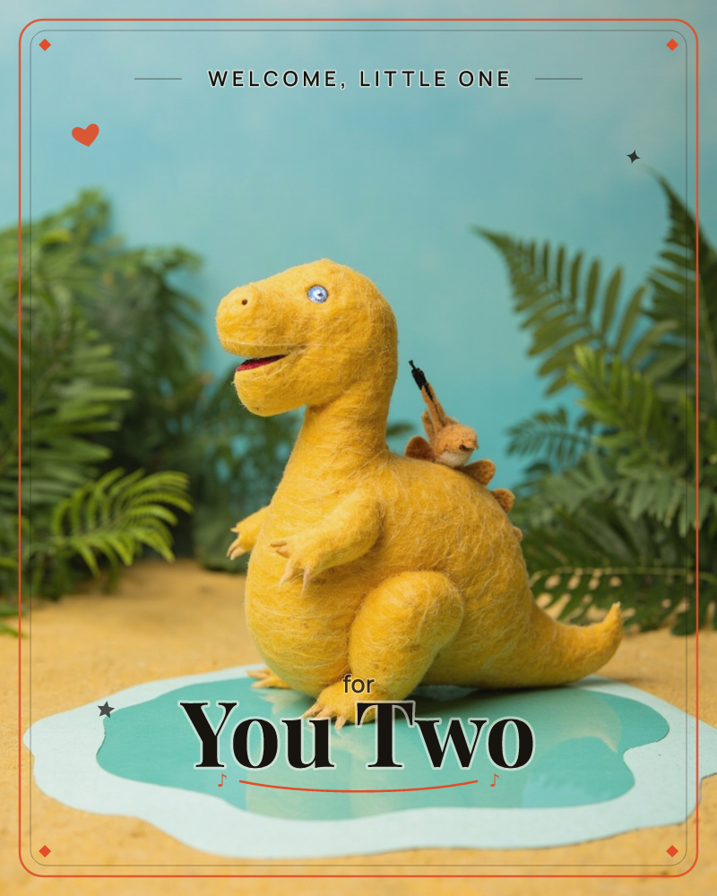 A felted yellow dinosaur stands on sandy ground with a tiny felted squirrel perched on its back, set against a backdrop of ferns and a soft blue sky, a new baby e-card design