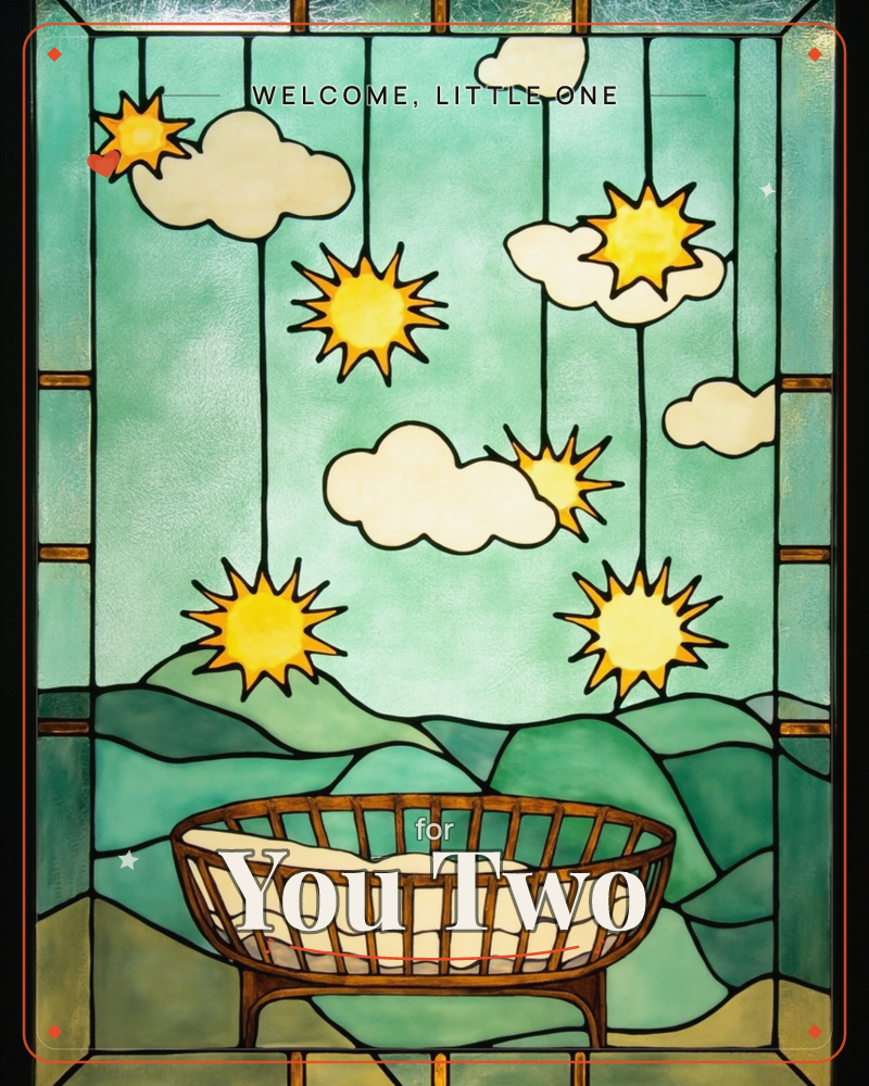 A stained-glass style window shows a wicker cradle sitting before rolling green hills, with clouds and starburst suns dangling from thin dark strings…, a new baby e-card design