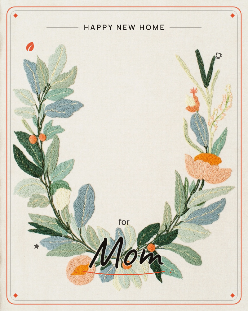 An open, horseshoe-shaped wreath is stitched onto pale linen, made from layered leaves in sage, dusty blue and cream, a new home e-card design