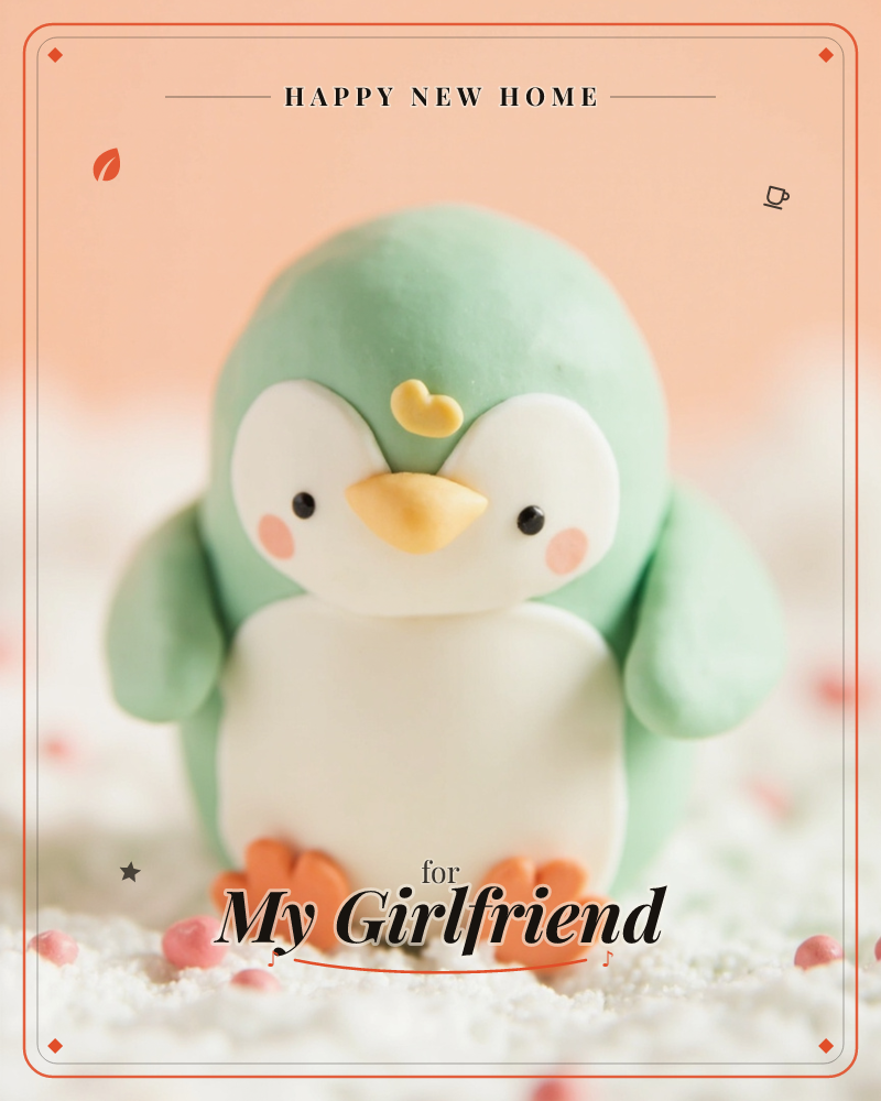 A small mint-green penguin figure, sculpted from clay or fondant, sits on a bed of white sugary texture scattered with tiny pink beads, a new home e-card design