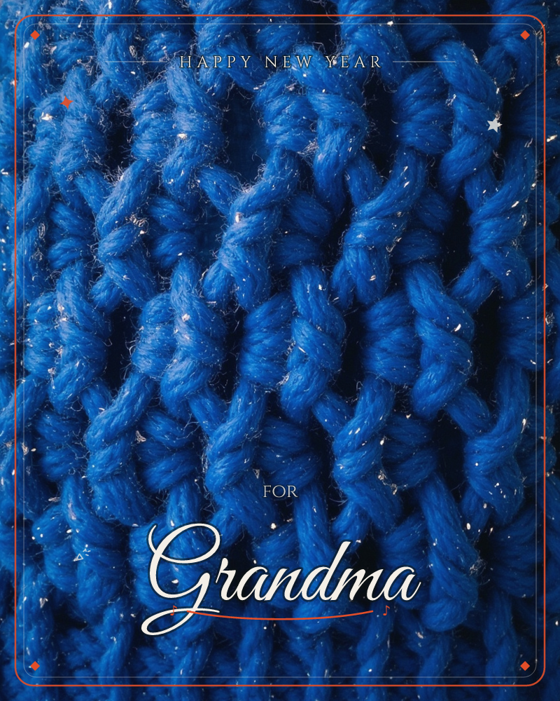 A close-up of thick blue knitted yarn fills the whole frame, its chunky ribbed stitches catching flecks of silvery glitter thread woven through, a new year e-card design