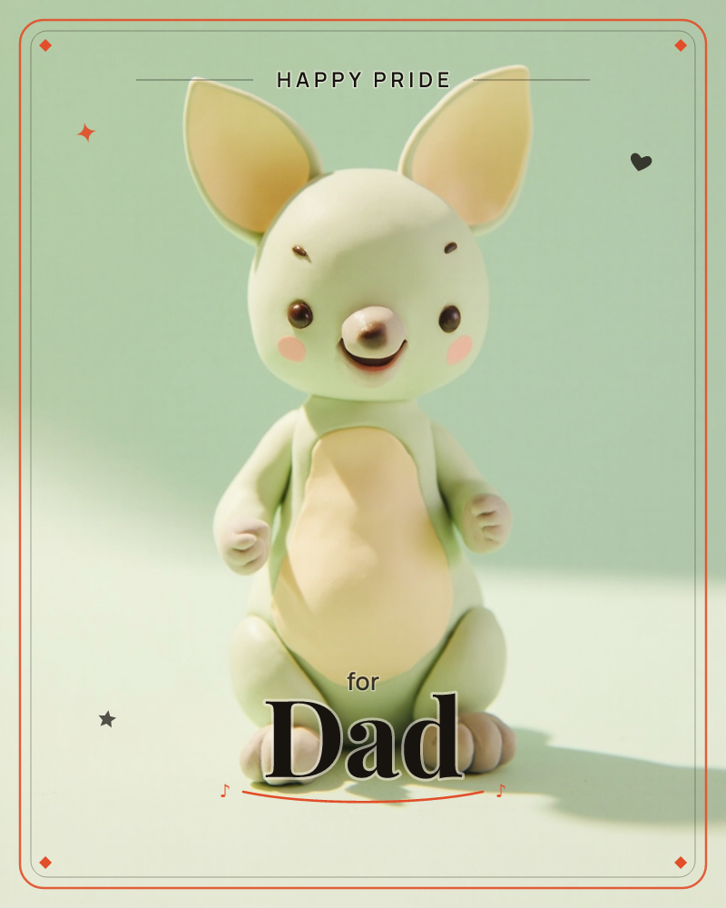 A soft sage-green toy creature with tall floppy ears and a rosy-cheeked smile sits alone against a plain pastel backdrop, a pride e-card design