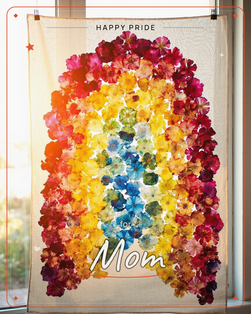 A sheer curtain hangs in a sunlit window, covered in pressed flowers arranged into a glowing rainbow arch of crimson, orange, yellow, green and blue…, a pride e-card design