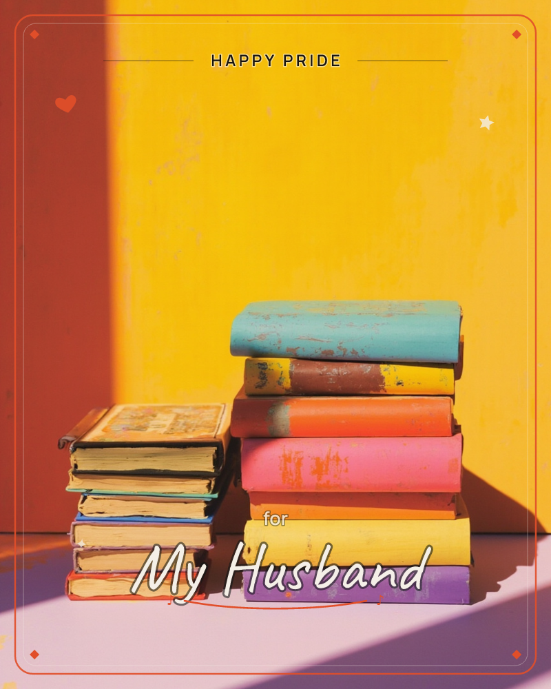 Two stacks of worn, colourful old books sit on a dark reflective surface against a wall washed in bold red and mustard yellow light, a pride e-card design