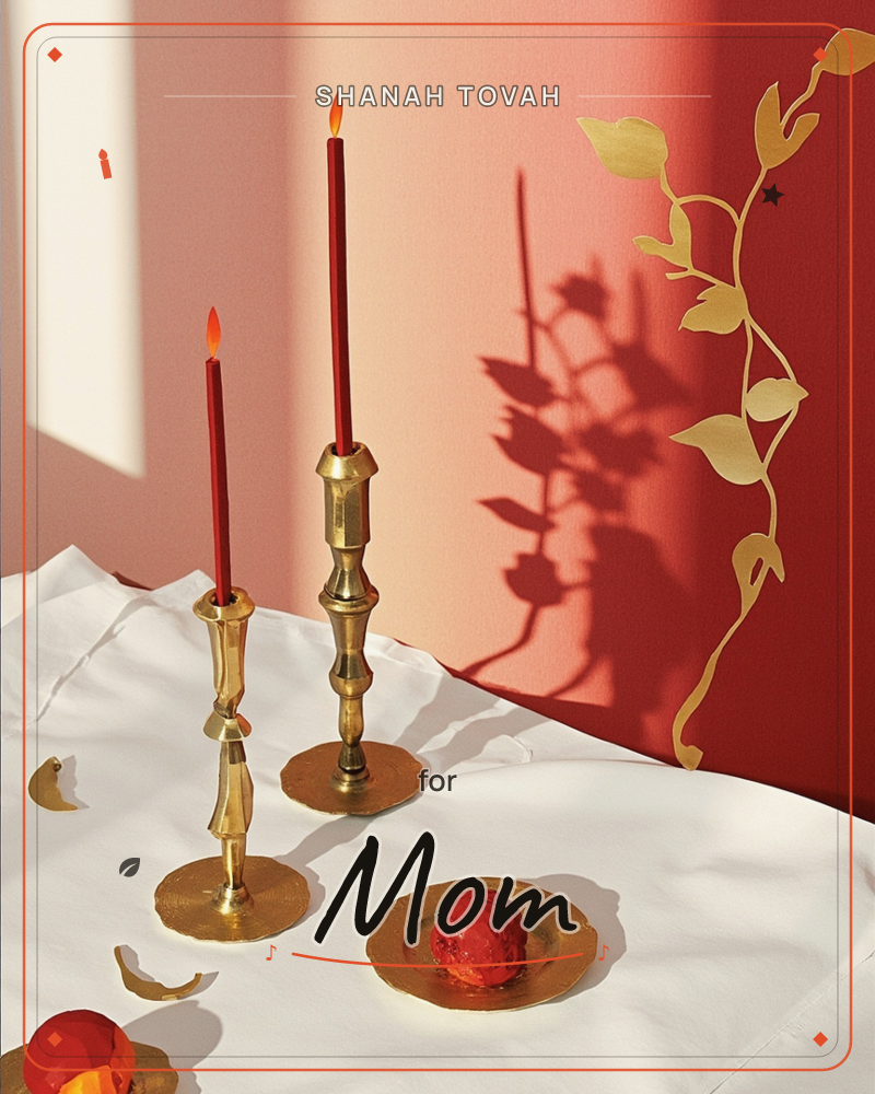 Two brass candlesticks of different heights hold slim burgundy candles burning against a warm red wall, their light casting a long, twining shadow that…, a rosh hashanah e-card design