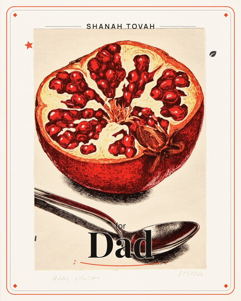 A pomegranate is sliced in half, its ruby seeds clustered in glistening rows against pale cream pith, a rosh hashanah e-card design