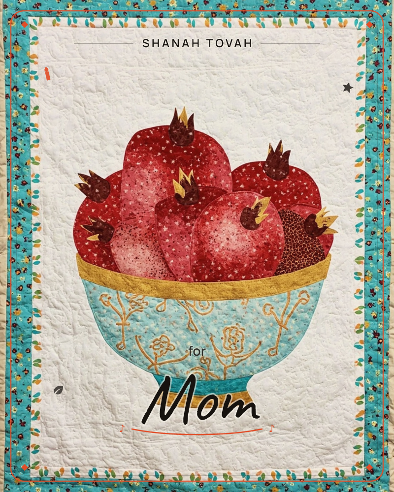 A quilted textile illustration shows a turquoise bowl painted with gold floral scrollwork, heaped full of deep red pomegranates with golden crowns, a rosh hashanah e-card design