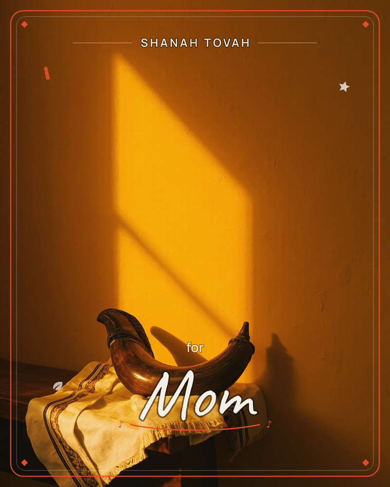 A curved ram's horn rests on a fringed embroidered cloth, its long shadow stretching up an amber-lit wall behind it, a rosh hashanah e-card design