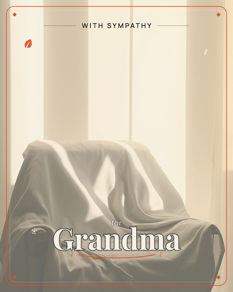 A dust-sheet drapes over an armchair in soft folds, lit by striped bands of light falling through a shuttered or curtained window behind it, a sympathy e-card design