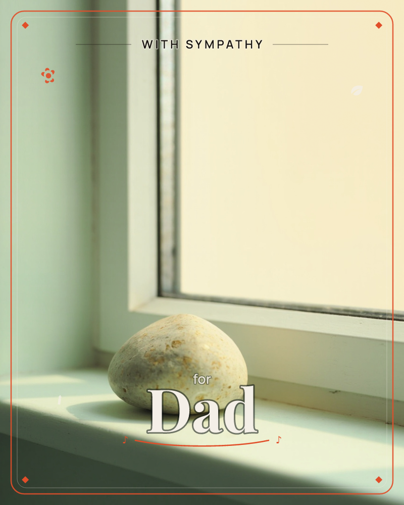 A single smooth, pale pebble rests on a white painted windowsill, lit by soft daylight glowing through the glass behind it, a sympathy e-card design
