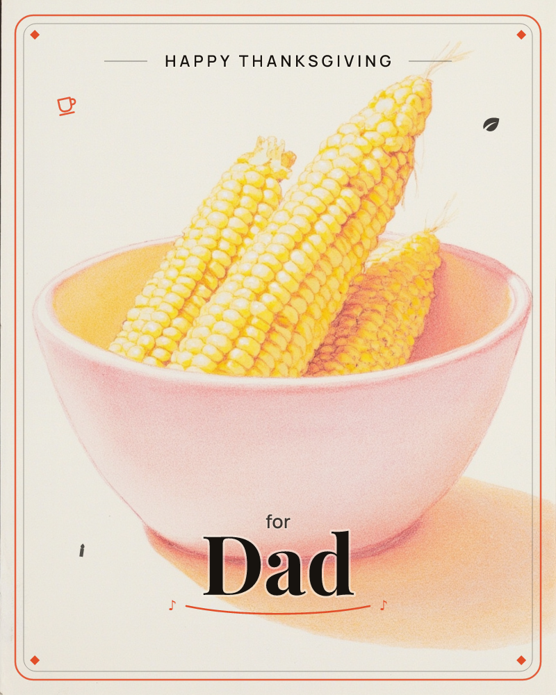 A simple pink bowl holds three shucked corn cobs, their golden kernels catching a soft, even light against a plain cream background, a thanksgiving e-card design