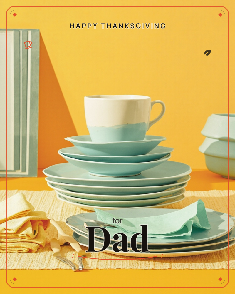 A stack of pale seafoam plates and saucers rises like a little tower against a bold mustard-yellow backdrop, topped with a cream and mint two-tone teacup, a thanksgiving e-card design