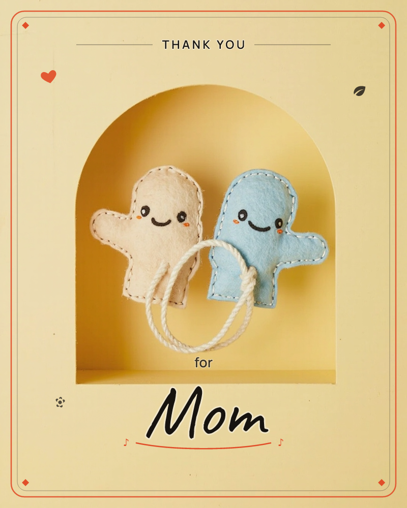 Two smiling felt ghost-shaped figures, one cream and one pale blue, sit tucked into a mustard-yellow arched niche, joined by a loop of white rope, a thankyou e-card design