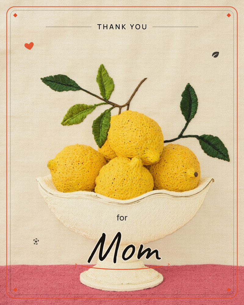 A cream pedestal bowl holds a cluster of textured, sponge-like lemons against a linen backdrop embroidered with green leafy branches, a thankyou e-card design