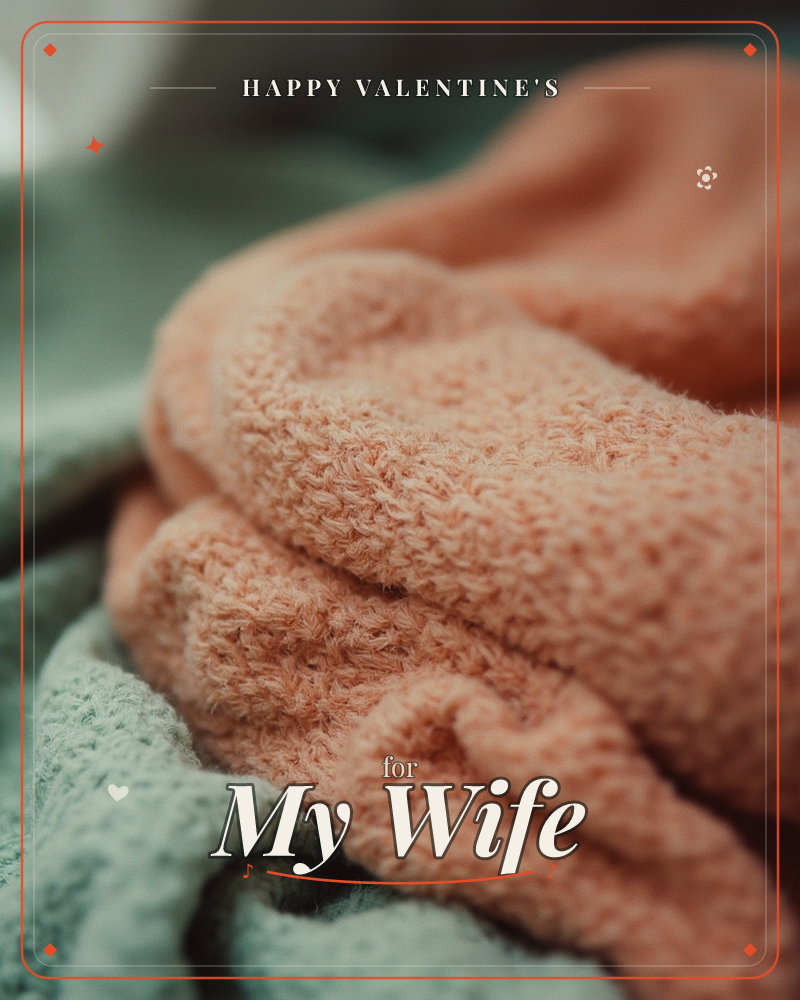 A close-up of a folded, chunky-knit throw in soft peach resting atop a sage green blanket, a valentine e-card design