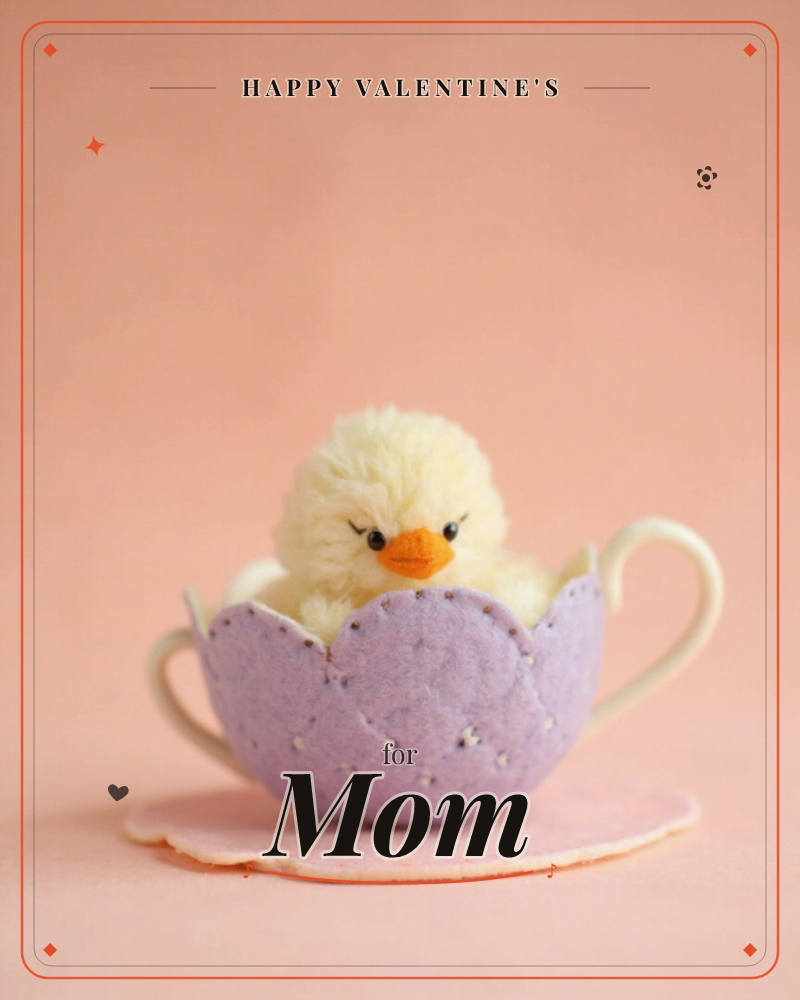 A fluffy pom-pom chick with a stitched felt face peeks out from a lilac felt eggshell shaped like a teacup, its handles curling out on either side, a valentine e-card design