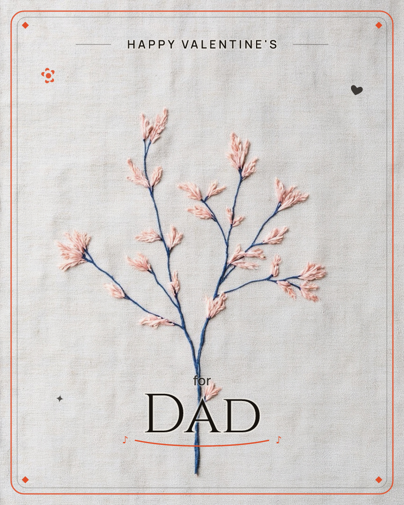 An embroidered sprig sits stitched onto pale linen, its navy thread branches reaching upward and outward like a bare winter twig, a valentine e-card design