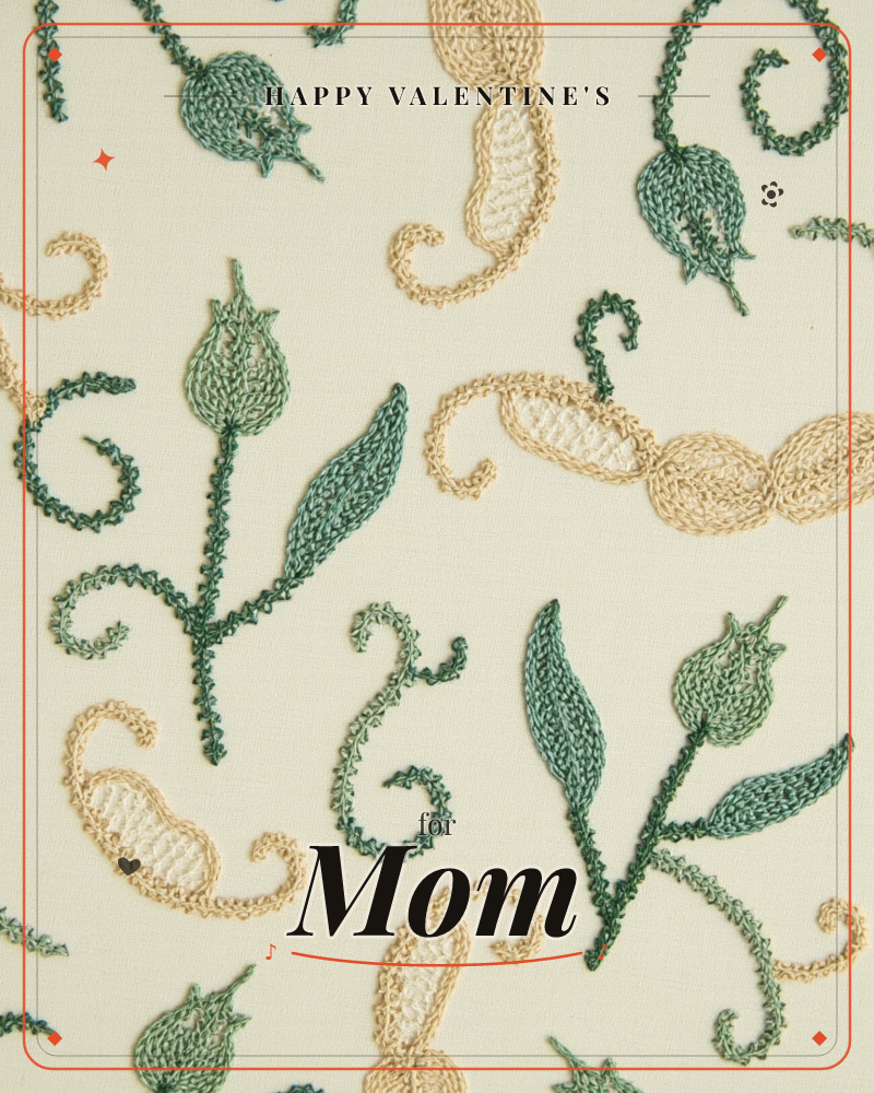 A close-up of embroidered fabric shows tulip-like buds and curling paisley shapes stitched in chain-stitch thread across a cream linen ground, a valentine e-card design