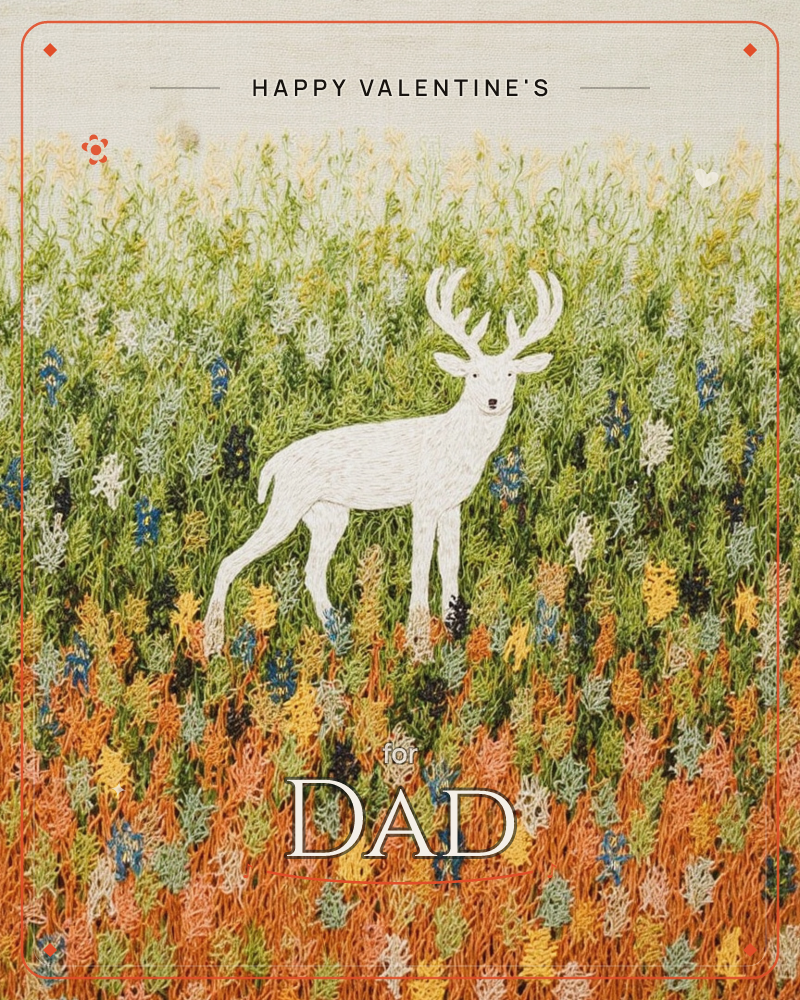 A white stag stands in a densely embroidered meadow, its antlers branching upward against a pale linen sky, a valentine e-card design