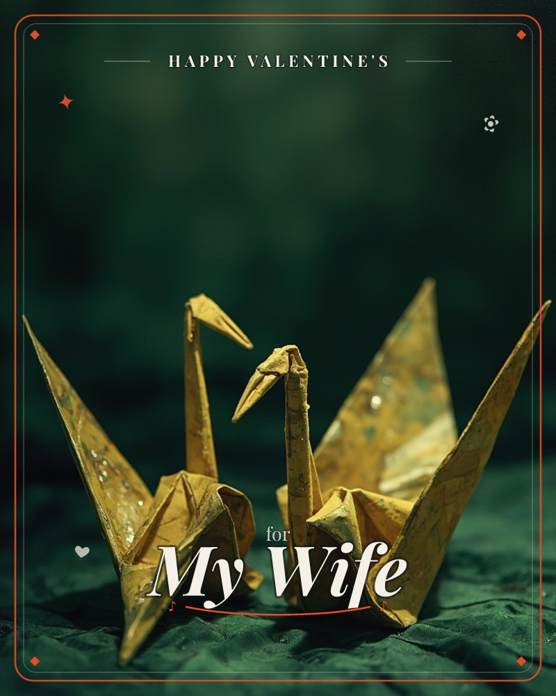 Two gold origami cranes stand side by side against a deep, moody green backdrop, their folded paper catching flecks of light like scattered dust or stars, a valentine e-card design