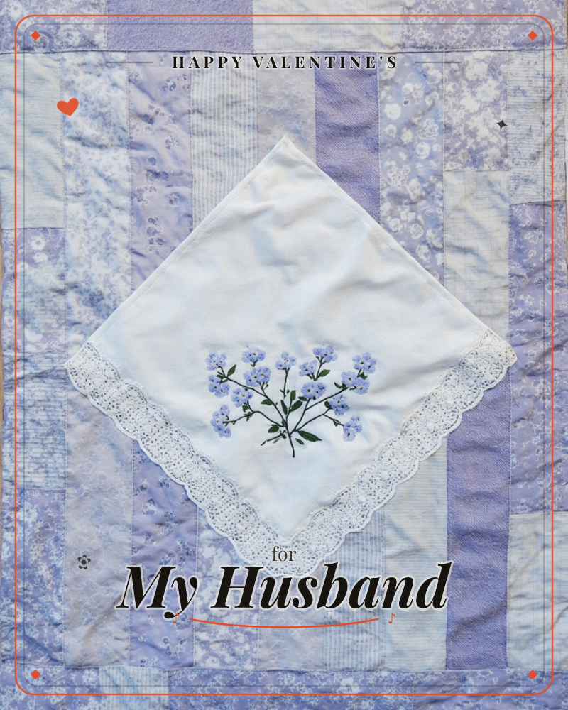 A white lace-edged handkerchief embroidered with a spray of forget-me-nots sits turned diamond-wise atop a patchwork quilt of lavender and pale purple…, a valentine e-card design