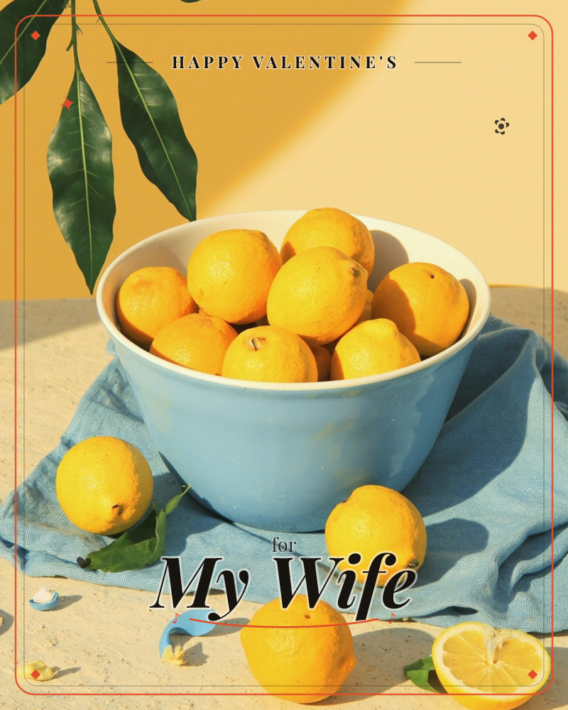 A pale blue ceramic bowl sits piled high with sun-ripe lemons on a rumpled blue linen cloth, a valentine e-card design