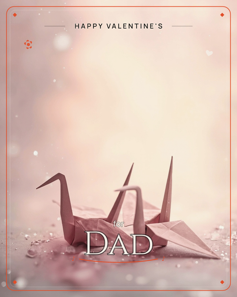 Two folded paper cranes rest side by side on a softly lit surface, their dusty pink paper catching scattered flecks of light like drifting glitter or snow, a valentine e-card design