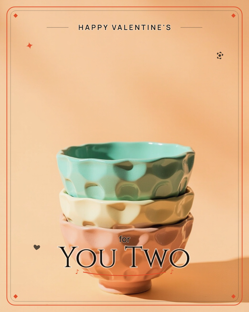 Three dimpled ceramic bowls in mint, cream and dusty pink are stacked on top of one another against a warm peach backdrop, a valentine e-card design