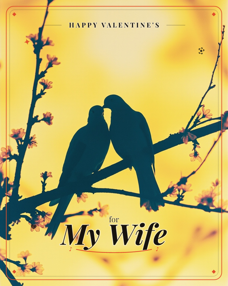 Two birds perch beak to beak on a blossom-covered branch, their silhouettes dark against a glowing golden-yellow sky, a valentine e-card design