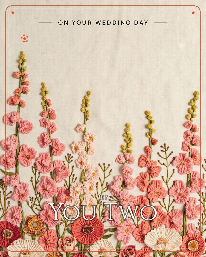 An embroidered garden border rises across a linen ground, tall hollyhock spikes in shades of pink and coral standing between mustard-yellow flower buds, a wedding e-card design